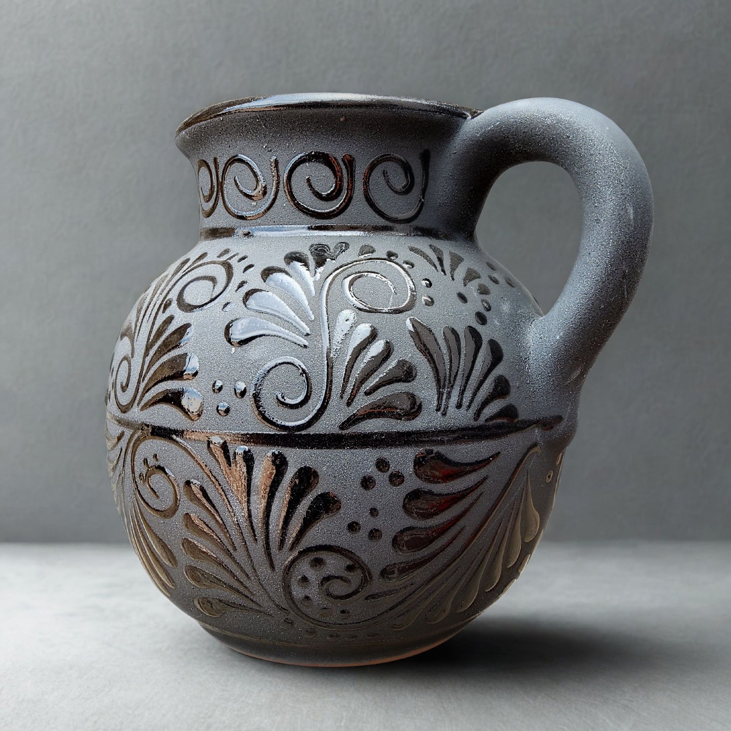 Decorative ceramic jar with intricate patterns on a gray background