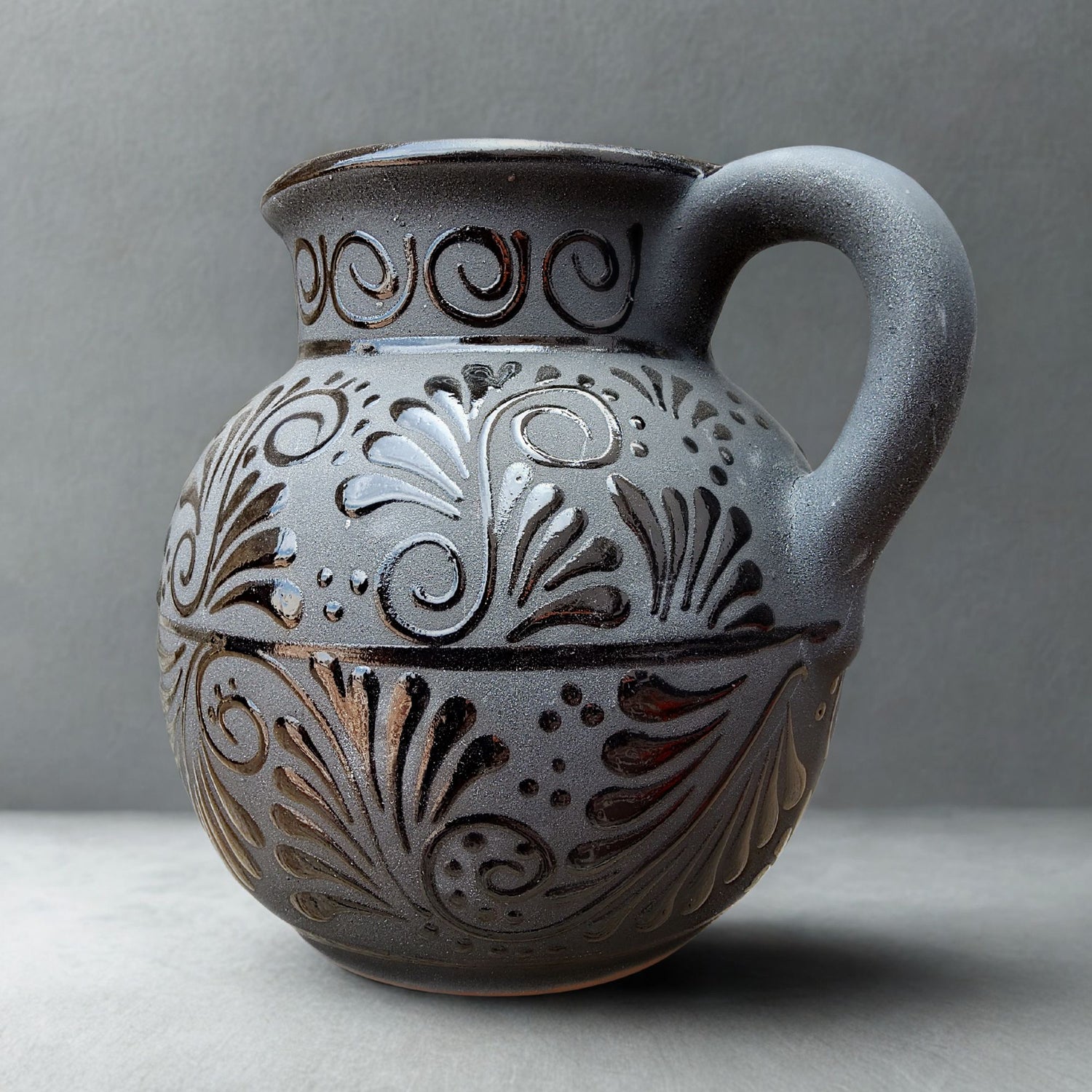 Decorative ceramic jar with intricate patterns on a gray background